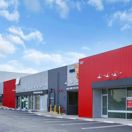 Vibrant red facade of exterior retail center redesign