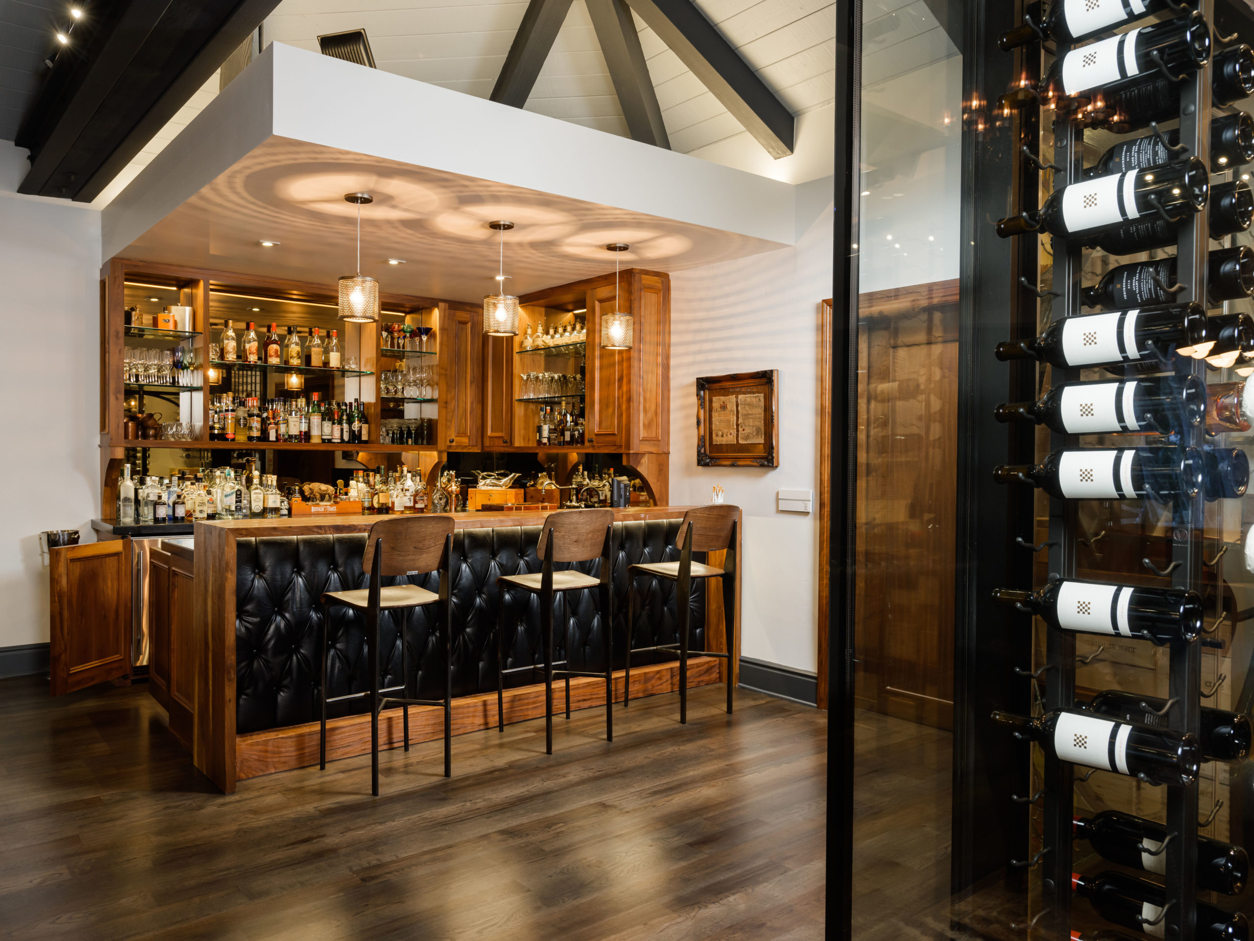 bar and barstools with soffit and lighting