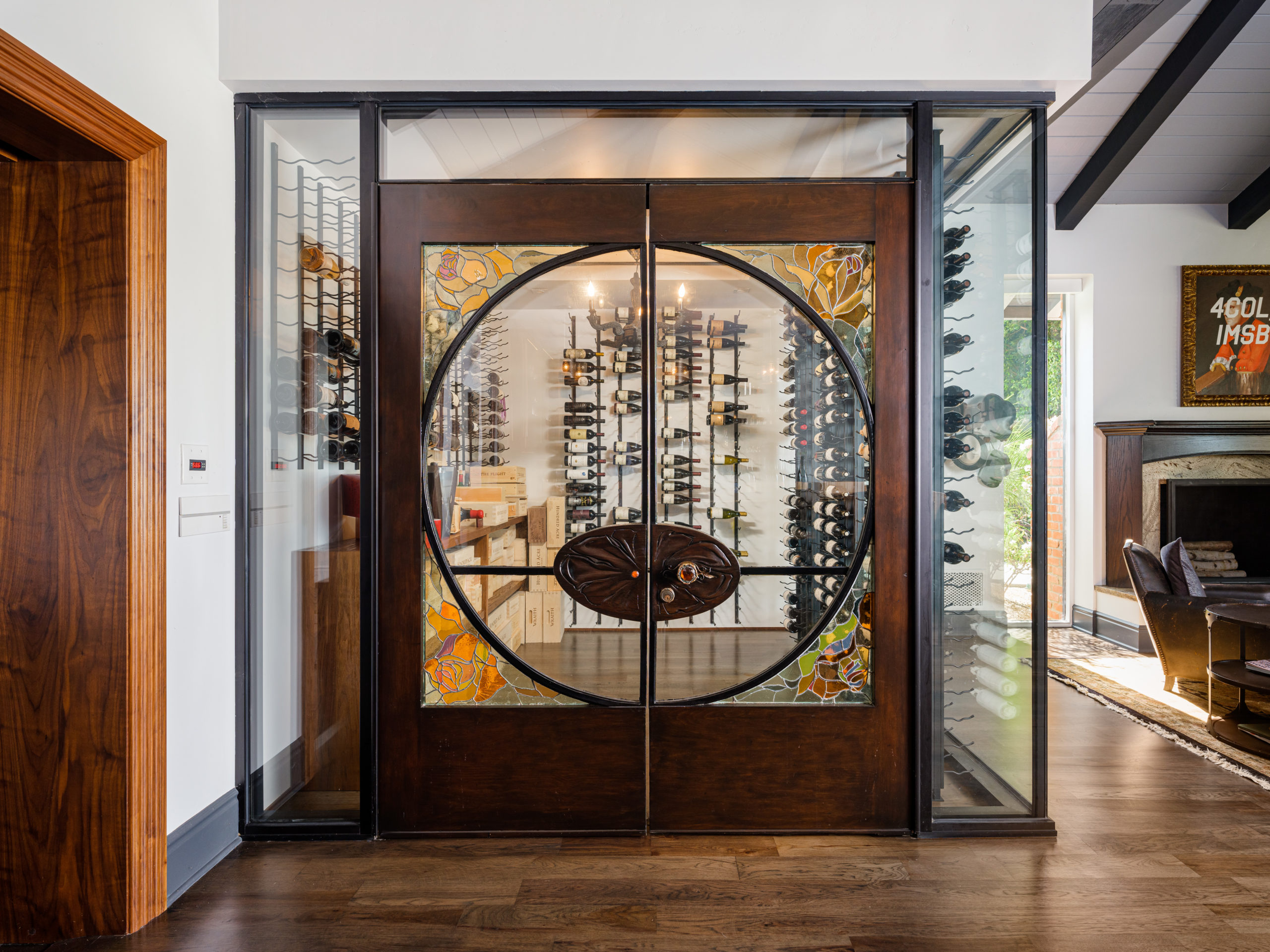 doors to a wine room with wooden floors