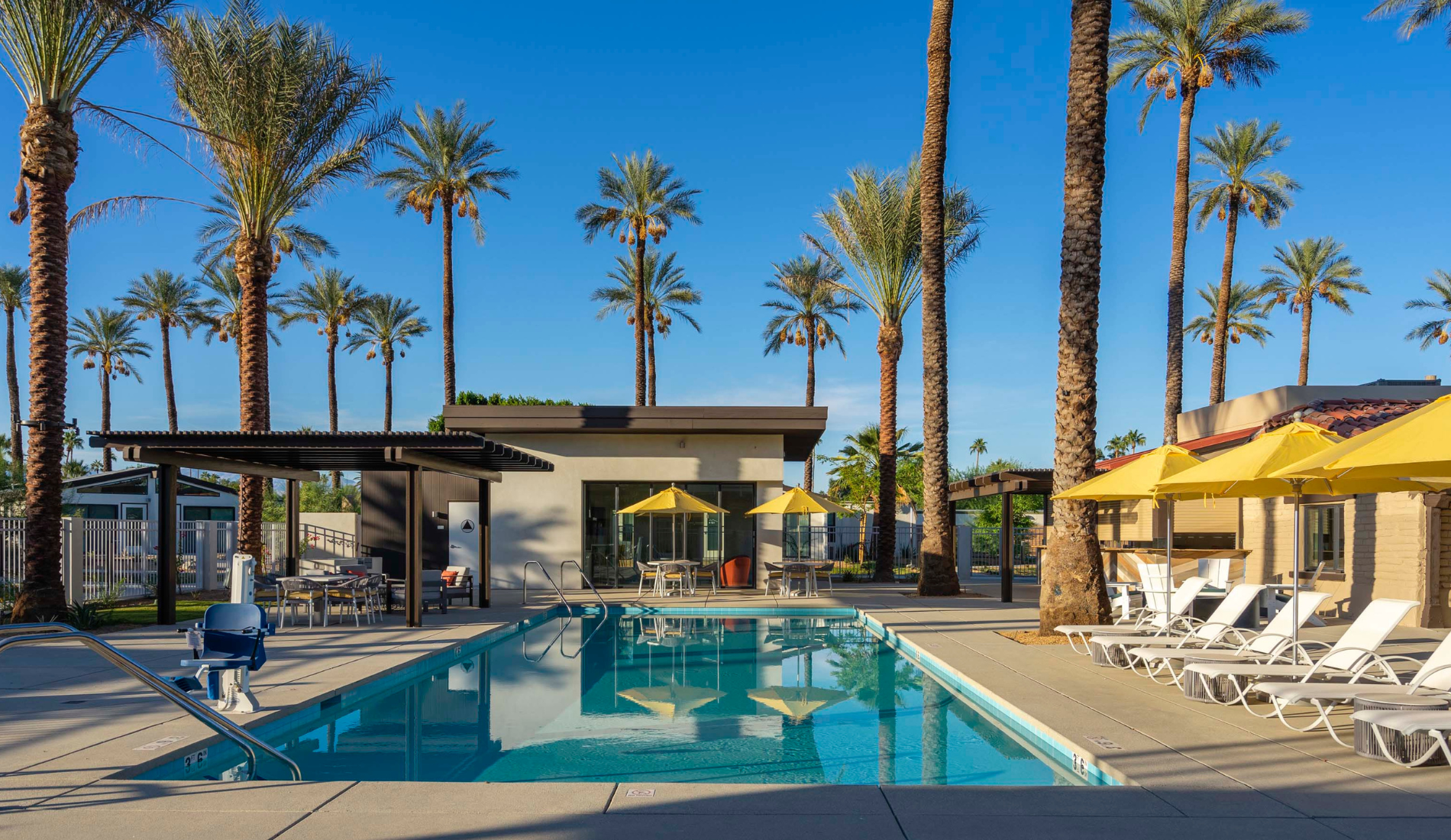 Palm Springs resort design, exterior, palm trees, pool, building
