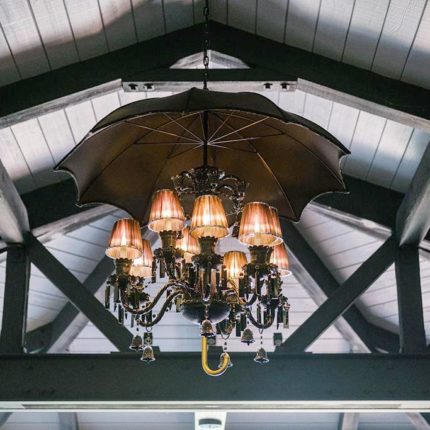vaulted ceilings with beams and chandelier