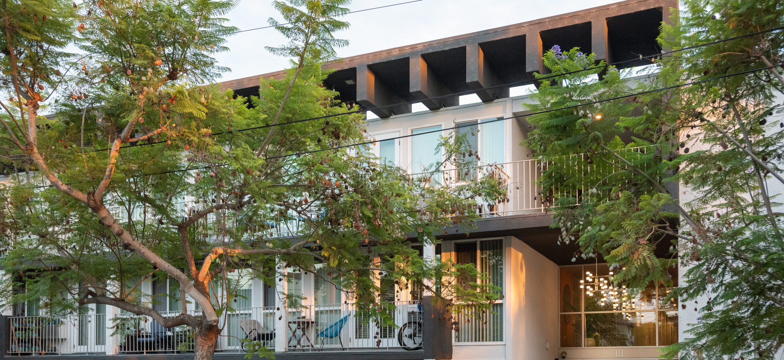 exterior facade of apartment building with trees