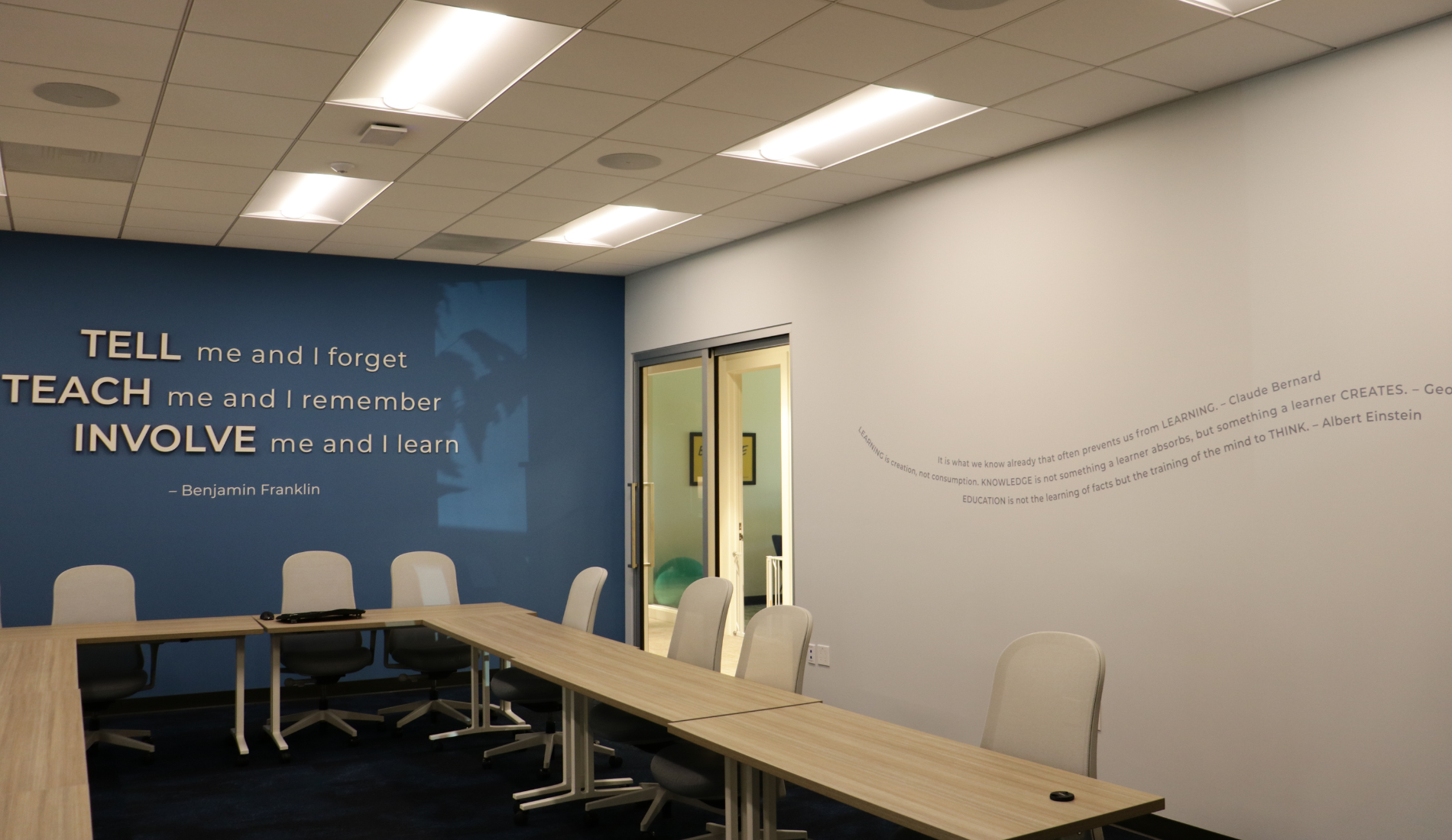 San Diego interior design conference room with seating, table and decorative wall