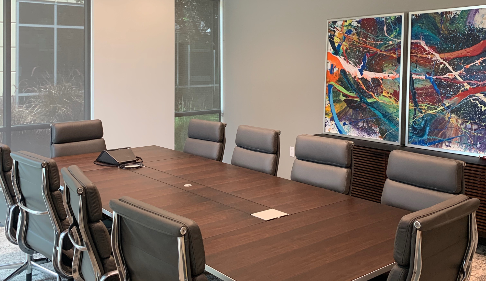 San Diego interior design conference room with seating, table, and art on wall