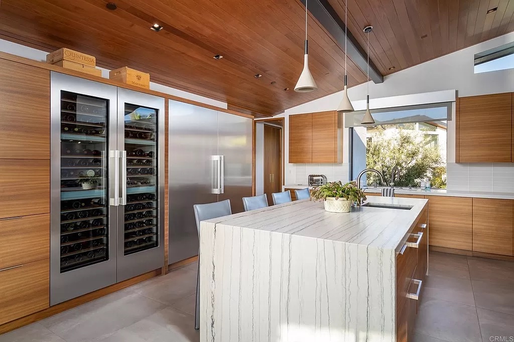 Interior kitchen table, refrigerator and wine cabinet,