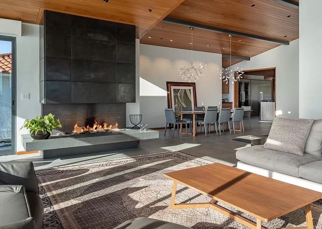 San Diego living room with fireplace, seating and dining table