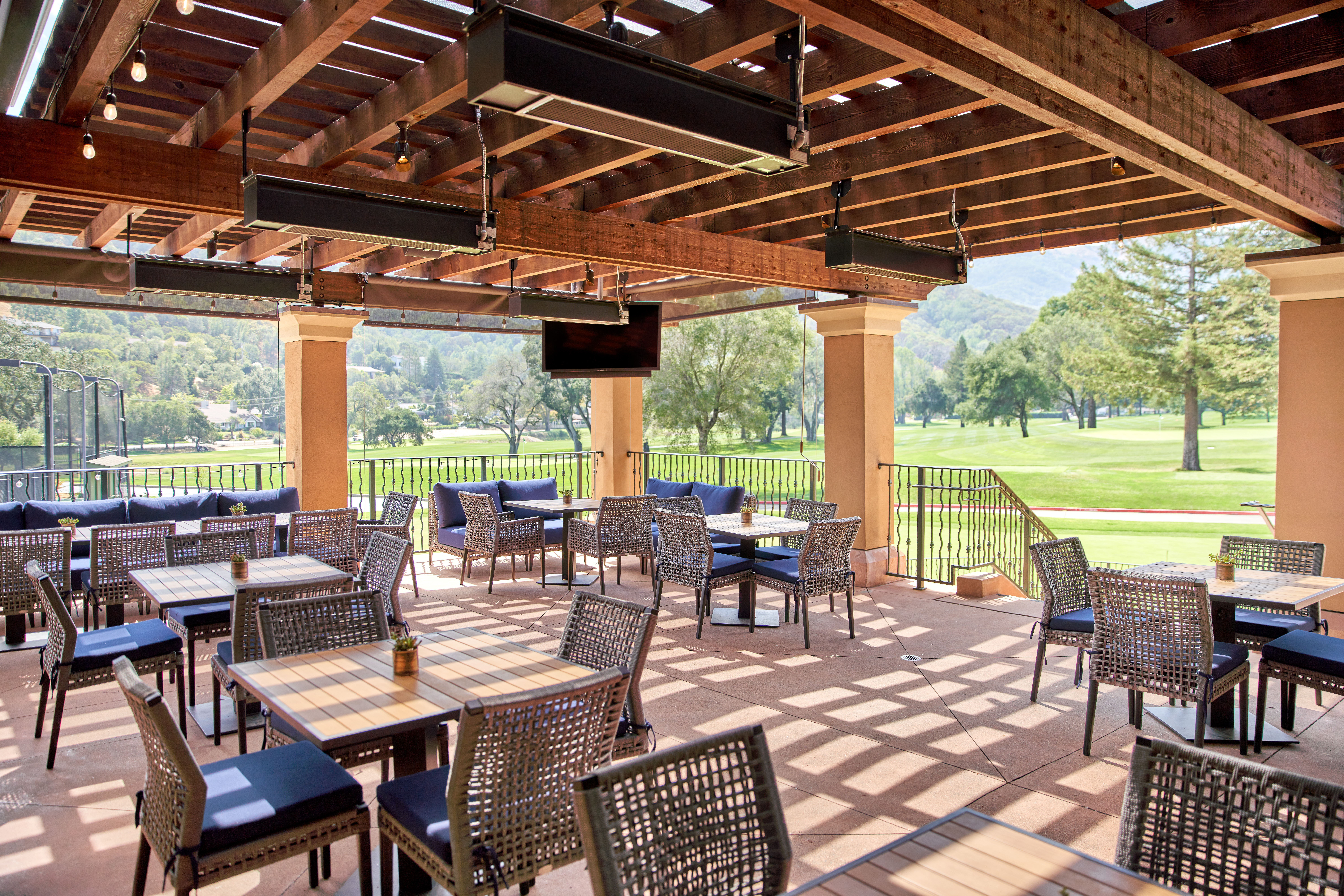 Upscale country club bar and restaurant exterior patio and furniture design, chairs and tables